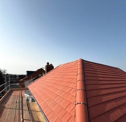 Premium clay tile roof installation laid with precision ridge detailing by Matt Merry Roofing, Hinckley