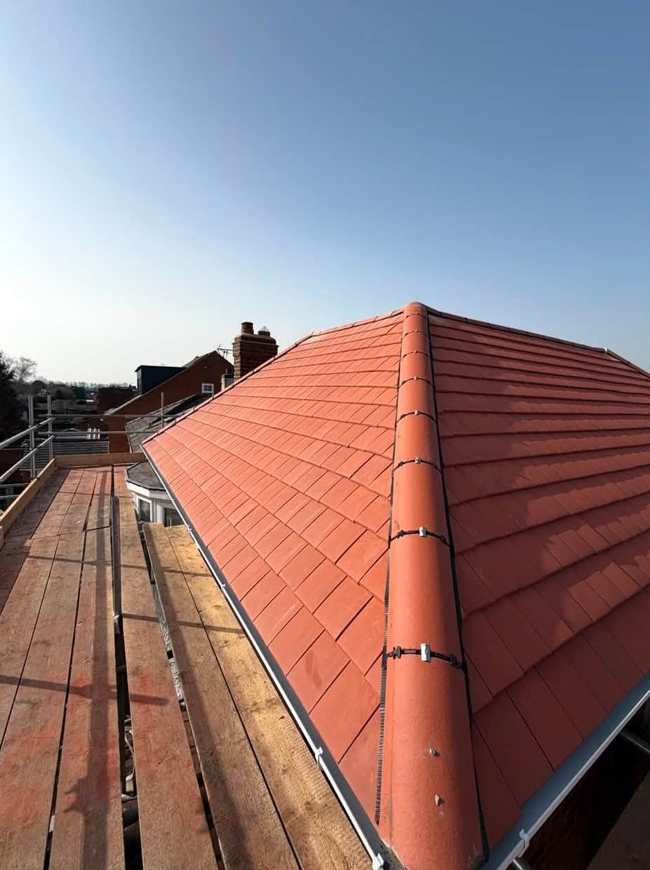 Newly tiled clay hip roof completed by Matt Merry Roofing in Hinckley, Leicestershire